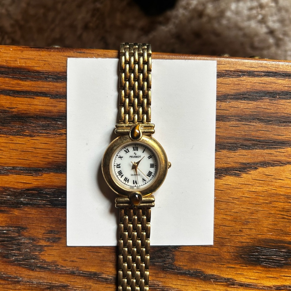 Peugeot Gold Women's Watch with Roman Numerals